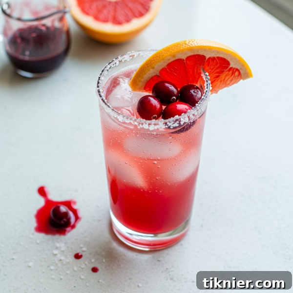 Cranberry Paloma Recipe with fresh cranberries and rosemary